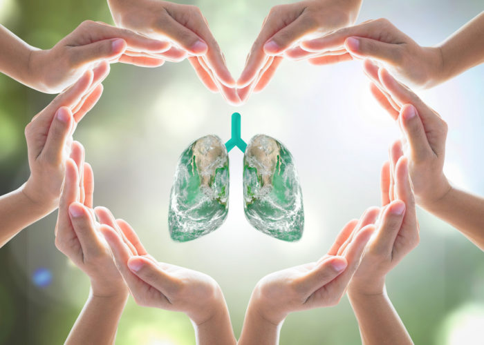 World no tobacco day campaign, lung in heart-shaped hand protection health care design logo concept. Element of this image furnished by NASA